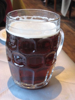 British_dimpled_glass_pint_jug_with_ale.jpg