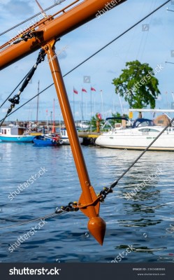 stock-photo-a-wooden-bowsprit-and-a-dolphin-striker-mounted-underneath-it-on-a-classic-sailing-ship-2341688065.jpg