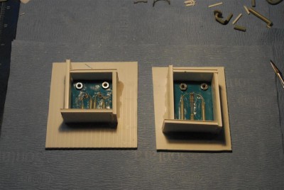 The mold box built around the part.  It's held together with hot-melt glue.
