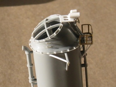Another view of the forward stack showing the two rows of hand railing on the top of the funnel.  These are very small and delicate features which understandably are not included in the kit.  I made these from some styrene strip and stretched sprue.  The two small rungs between the railings are from old PE.  I need to work more on the whistle platform where it meets the funnel cap.