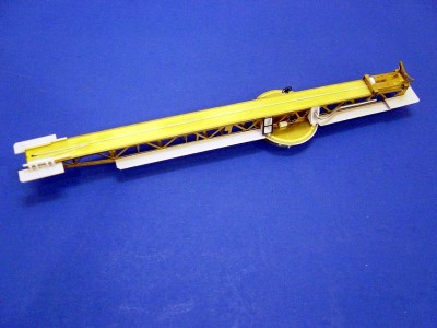An overhead view of the left side of the catapault. The basic structure is photo-etched brass from JR Haynes. It comprises 14 individual parts. The aircraft cradle also comes with it, and has 6 parts. Anything not brass I have added. Note the catwalks. These also come with the catapault, but I found them difficult to bend into shape, so I made my own from .020 diamond plate sheet styrene.
