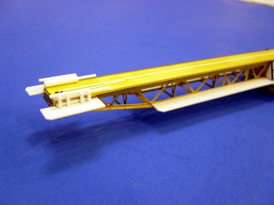 The forward end of the cat. Note the "bumper" set up for the cradle. These were hydraulic, I assume and stopped the forward momentum of the cradle. The aircraft were accelerated from 0 to 80 mph in under 2 seconds. A 5" charge without the projectile was used to "fire" the aircraft off the cat. Bumpers are made from styrene rod and consist of 8 pieces.