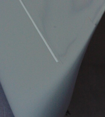 After sanding I added a coat of primer which laps onto the styrene strip