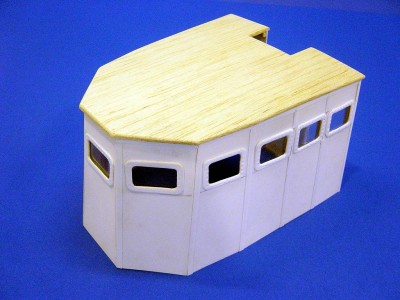DSC03705.JPG (154.47 KiB) Viewed 20049 times Portside overhead view here. House is made from balsa and sheet and strip styrene. There are 11 windows, or ports. Only two open, just behind the center one. I represented it open, while all others are glazed over with thin clear styrene. Roof is 3/32" balsa, and house walls are .020 styrene.
