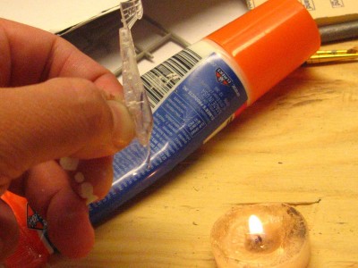 heating the clear film with a candle and at the same time burning my knuckles!