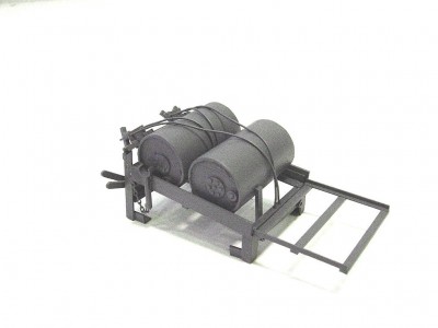 Here is one of four depth charge assemblies. There is one port and one stb. about midships, and two aft. These were fabricated from various sizes of strip and angle styrene, utilizing photos and drawings as a guide. The charges are cast resin from "Macs Mouldings" of the UK. Cable stays are thin steel wire. There are 53 parts to each assembly. This is one of the aft racks.
