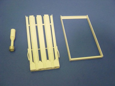 Heres the three main parts to the assembly. On the left the rocket ,not completed. Middle shows the rails and to the right is the rail frame. All styrene used here.