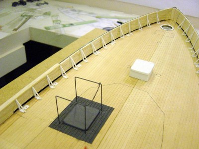 Note the grey hatch here. This is inside the pilothouse. Placement of this and the crew figure was a bit tricky as the p/h goes over the top of this. Note railing and safety chain. I have added 1/16 balsa to cover the rough fibreglass on the inside of the bulwarks. Also added the bracing for the bulwark from strip styrene. Note the fwd scuttle with grating installed instead of "manhole" cover to facilitate airflow.