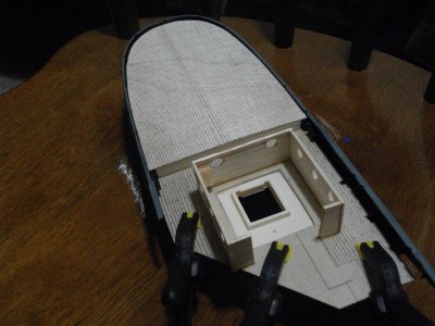 IMGP0856.JPG (138.67 KiB) Viewed 2669 times Here is the model just after the application of the main deck. The superstructure has also been applied. The portholes are kind of large but a regular hole-punch is all I had to work with.