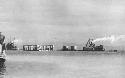 floating drydock, a double-bubble gasoline barge, a crane barge, and a radar repair barge.jpg