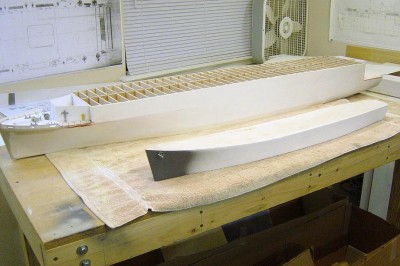 DSC04154.JPG (98.28 KiB) Viewed 4361 times Here are the results. Both hulls have now been treated with the polyester resin first, then two coats of the finish gel coat. Sanded smooth between each coat of both materials. I worked one side at a time. The sealing and finish quality of the gelcoat worked great, and it was relativly easy to sand. I used 200 grit auto paper. Note the white color. Although you can't see it well in the photo, both hulls are very smooth and sealed very well.
