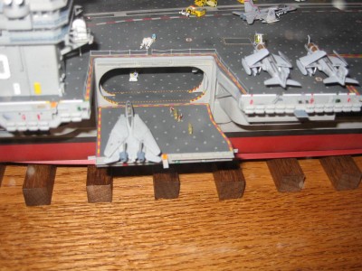 red shirts moving the bomb carts