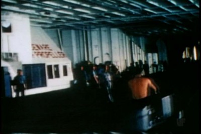 Same area as above in this still from "The Fighting <br />Lady" circa 1943.  Probably USS Yorktown CV-10 <br />but could be another ship as footage of others was <br />included in the film. Note that the conflagration <br />station is shaped differently than what's shown in <br />AOTS drawings for USS Intrepid CV-11.