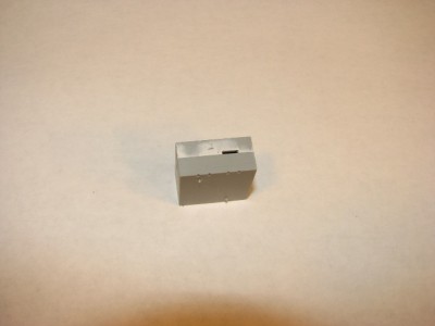 The sanded putty shows the low spots that have been filled in.