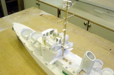 Another view here, looking fwd. Note the mushroom vents and refueling hoses behind the mainmast. I have also fabricated and installed the flagbags. A few more detail parts yet to be added to the bridge.