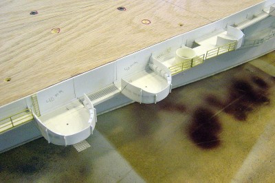 Close up view of the 40mm platforms on portside. There are three more of these arrangemants on this CVE. To the right of these is the MK.51 gundirector location for the 40's, then far right is a 20mm location. Note the ammo boxes inside the 40mm shield.