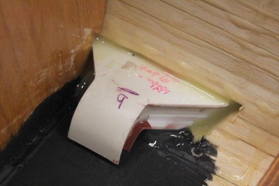 Painting black anti-glare panel and glueing the seabox with epoxy permanently into the hull structure.