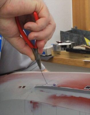 Sawing.