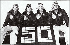 (L to R) LTJGs, Harris Mitchell (10 victories), Armistead "Clint" Smith (6), James French (11), and LT Eugene Valencia (23). These four pilots of VF9 flying off Essex and Yorktown, shot down 50 enemy planes. They hold the record as being the highest - scoring fighter division in Navy history (ussessexcv9.org/Bravepages/gallery; Reynolds, pg. 294).