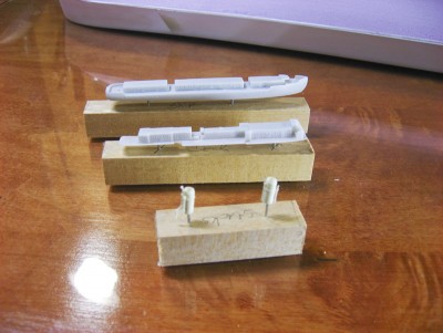 Major resin parts mounted to wood blocks for handling during construction.