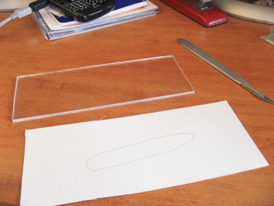 I cut a piece of Plexi to glue the watercolor paper to for the water base.  It's straight and flat and will stay that way.