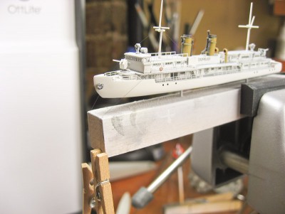 IMG_3836.jpg (107.07 KiB) Viewed 2233 times When rigging I normally use clamping tweezers or hemostats to clamp onto the line and keep it taught. That's too much weight in 1/700, so I'm using these tiny wooden clothes pins. I think they're for doll clothes or something, but they work great and provide just enough light tension to the line.