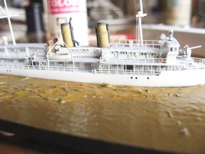 A close-up showing the rigging and the wake laid in with acrylic gel applied with a knife blade.  I really like the water texture that the watercolor paper provides.  I'll be using it from now on.