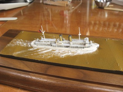 I did the wake with white paint and lots of stippling with an old brush and glaze medium.