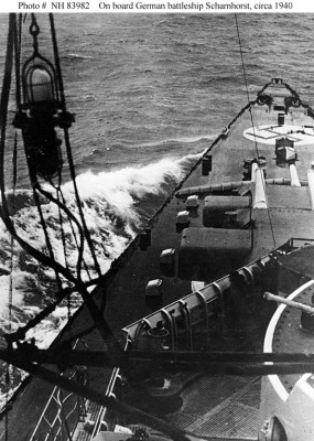 The raised deck hatches along side the forward turrets indicate that the ship in the photo above is actually Gneisenau, not Scharnhorst.  Compare this photo to the photo below.
