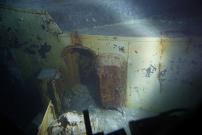 ....but looking at the other side it is the curved wall that houses the gun director. The outer space within the door is the forward command post. The heavy doors were almost certainly opened by sailors attempting to abandon ship, as there is no blast damage.