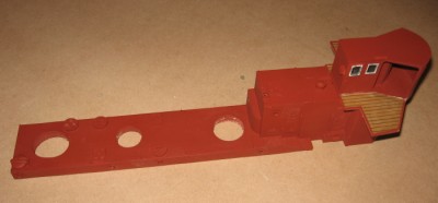The super structure in primer with the funnel and ventilator holes drilled. The whole superstructure will eventually be glued to the removable deck section.