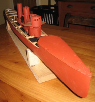 The deck house structure being tried on the un-decked hull.