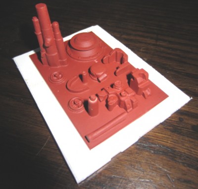 The master for making the gun component mould. Each part was modelled in plastic before being mounted on the base.