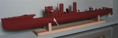 The lattice work supports for the bridge wings remain fixed to the deck while the bridge and boiler room roof lift off.
