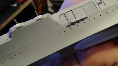 Dimple as described; the exact same thing is present on the opposite side of the hull. Note the small platform, which in the stock hull is a bit odd-shaped based on some other hulls I've seen. While this may not be perfect, it's probably a decent enough effort though it'll still need a little more smoothing in addition to fixing the divot(s).