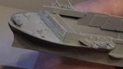 Port forecastle, ditto for the previous image. Though you can't really see it, the divots for both sides have been largely addressed. Another coat of primer will put that to the test.