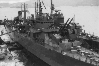 Landing ship No.9 at Kure on 3 September 1944, the ship on her left is kaibokan Okinawa 2.jpg