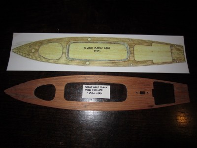 The original plastic card deck next to the strip wood planked version.