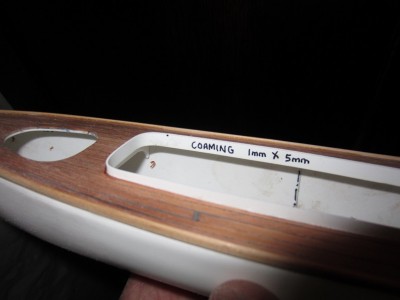 Deck aperture coaming designed to exclude water.