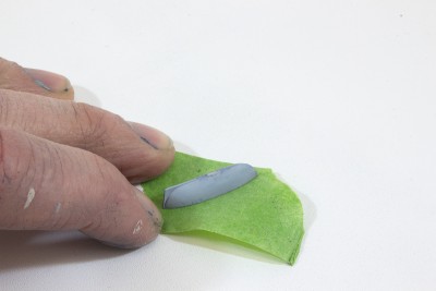First I press my inverted launch onto acid free masking tape.  You can use regular masking tape as well.  It will get coated with CA and paint so will probably be just fine for years.