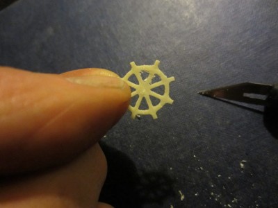 A blade scrapes away any flash around the edges.