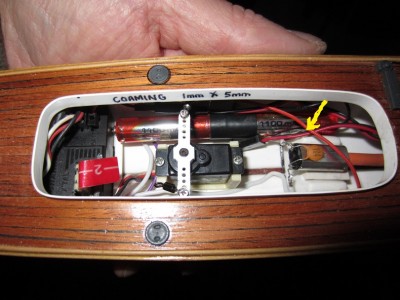 The internal electronics installed. The arrow indicates the charging point.
