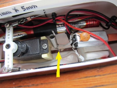 The retaining spring hooked onto an eye ring set in the bilges.