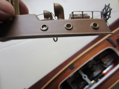 The wire hook protrudes low enough to make it easy to hook on to the retaining spring.