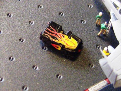 I saw a picture of a deck tractor on a CVN all done up like a hot rod like this and at the last minute decided to put one on my deck.  I don;t think the picture was from Reagan, but sue me, I don't care, it is cool looking!  (and yes, it is supposed to be gloss paint)