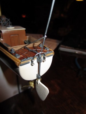 The ensign flag staff slots into these four eye rings.