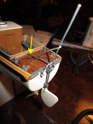 The two stay bars should have been connected to the back lip of the cockpit rather than to the deck. The yellow arrow shows the tiller which was shortened slightly.