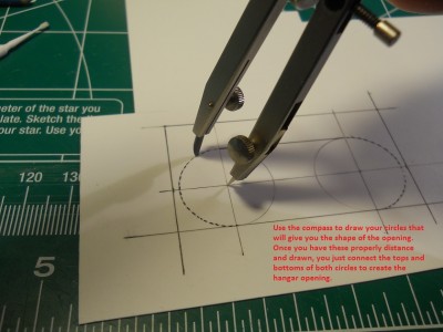 The compass is used to create the "inner door curves" or hangar openings.
