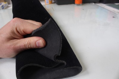 It has a thick, rubbery quality, but a nice black velvet finish.