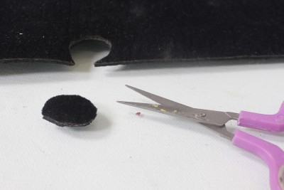 Just cut an oval that's ever so slightly larger than your funnel.